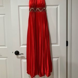 Red formal gown with decorative beading in the front